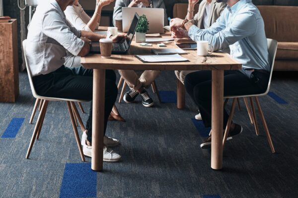 Confident,And,Successful,Team.,Group,Of,Young,Modern,People,In Confident and successful team. Group of young modern people in smart casual wear discussing business while sitting in the creative office
